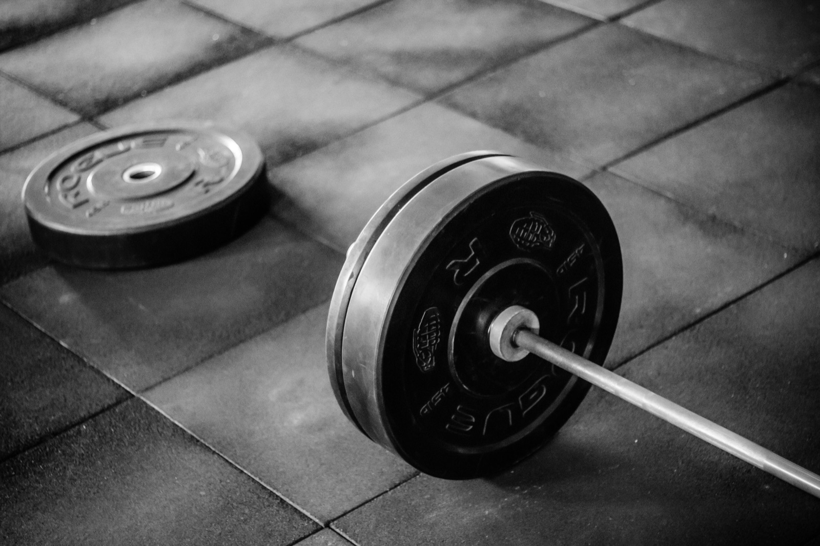 Loaded barbell on the gym floor